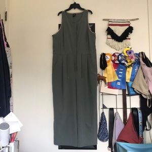 Sage green REI jumpsuit with hidden front buttons and waist cinch. Worn once